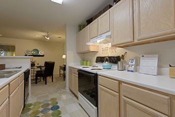 a kitchen with light wood cabinets and a checkered floor at Lake Cameron, North Carolina, 27523